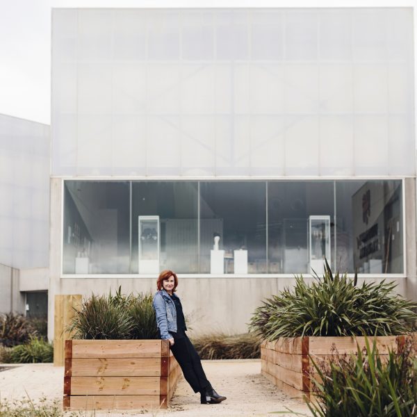 Images of Lindy Hume sitting in front of the Burnie Makers workshop