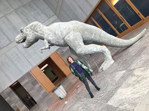 Lindy in front of a paper mache Tyrannosaurus Rex by Estonian artist Edith Karlson