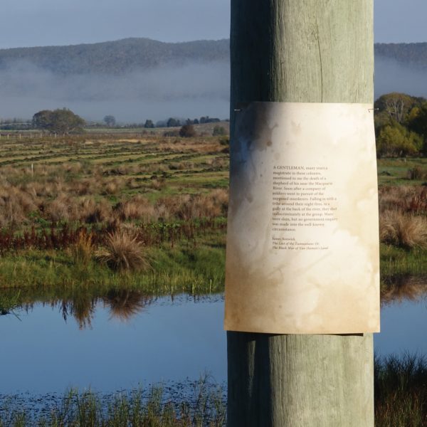 Piece of paper pinned to a telegraph pole for Julie Gough: Fugitive History
