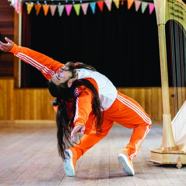 Man performing within a community hall